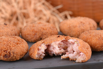 Fried and breaded codfish cake, fish empanadas, codfish cake, Brazilian-style codfish cakes, meat disc