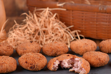Fried and breaded codfish cake, fish empanadas, codfish cake, Brazilian-style codfish cakes, meat disc