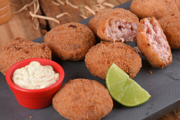 Fried and breaded codfish cake, fish empanadas, codfish cake, Brazilian-style codfish cakes, meat disc