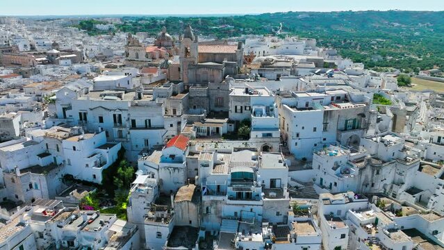 View from above over Ostuni city in Italy&rsquo;s Apulia region. Close up aerial view of the Cathedral with its fascinating Byzantine, Gothic and Romanesque styles to the stunning Piazzetta Cattedrale.