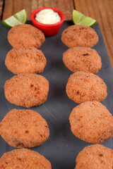 Fried and breaded codfish cake, fish empanadas, codfish cake, Brazilian-style codfish cakes, meat disc