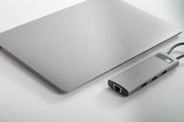 The USB adapter is connected to a laptop with various inputs for a flash drive, hdmi, ethernet,...