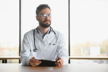 Young and confident male doctor portrait. Successful doctor career concept