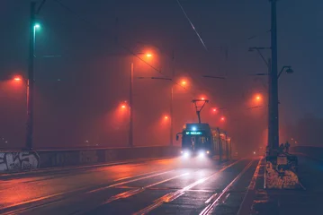 Papier Peint photo Berlin berlin tram in fog, tram in foggy wet weather, A Berlin tram drives over a foggy bridge, blurry