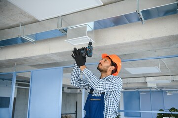 Ventilation cleaning. Specialist at work. Repair ventilation system (HVAC). Industrial background