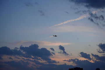 airplane in the sky at sunset