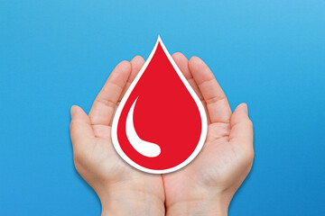 Blood donation concept on blue background