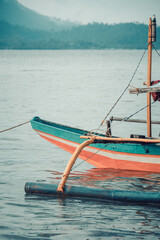 Puerto Princesa, Palawan, Philipines. Traditional Bangka catamaran boats in a bay in Palawan used by fishermen to go fishing. Tranquil scene, serendipity.
