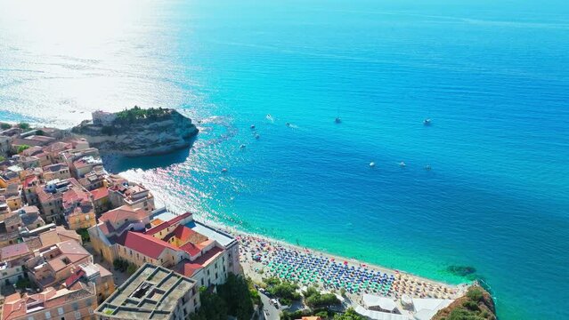 View from above of Santuario di Santa Maria dell'Isola di Tropea in Calabria, Italy. Aerial view of rooftop Byzantine stone houses build on a clifftop in ProRes 4K.