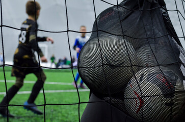 Bag with balls on soccer field