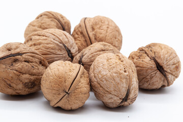 Handful of walnuts on a white background