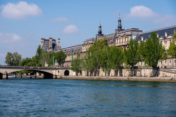 Fototapeta premium View across the Seine to the Louvre Museum