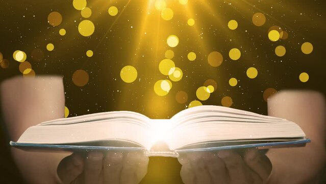 Magic Book in Man Hands with Glowing Golden Lens Particles and Light Rays on Dark Background. The fairy tale Book of Magical Stories.  