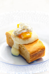 sponge cake with vanilla custard, peach and whipped cream