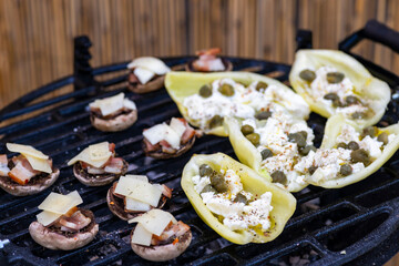 grilled peppers with feta cheese and capers and mushrooms with bacon baked with Emmental cheese