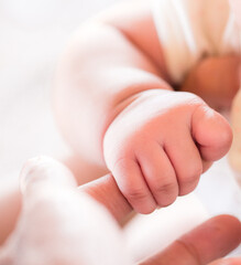 Baby hand,Newborn baby hand in mother hand, mother and her baby, happy family concept, beautiful conception image of childbirth.