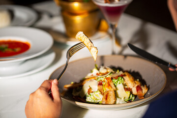 Woman eating at the table,Young Asia woman eating spaghetti at restaurant