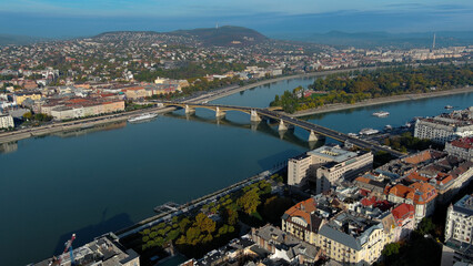 Fototapeta premium Establishing Aerial View Shot of Budapest, Hungary at sunrise. Margaret Bridge or Margit hid over River Danube, embankment