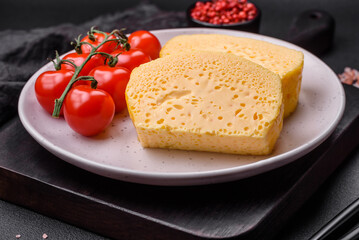 Delicious omelet with milk, spices and herbs cut into large pieces