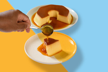 One hand holds a spoon with caramel syrup over a pudding dish, pour caramel syrup over the pudding, a cup of caramel on a yellow and blue background