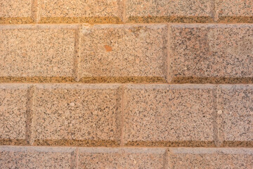 Background of brick tiles on the wall close-up