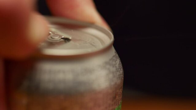 close-up opening soda can in super slow motion
