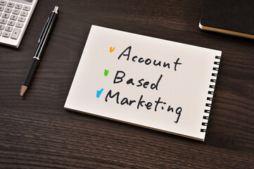 There is notebook with the word Account Based Marketing.It is as an eye-catching image.