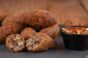 Fried and breaded codfish cake, fish empanadas, codfish cake, Brazilian-style codfish cakes, meat disc