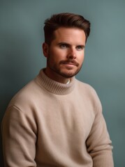 Fototapeta premium Portrait of a handsome young man in sweater. Men's beauty, fashion.