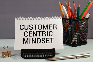 Customer Centric Mindset write on a book isolated on Office Desk.
