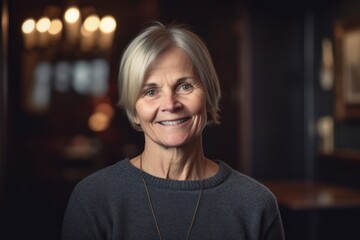 Portrait of a smiling senior woman looking at camera in a restaurant
