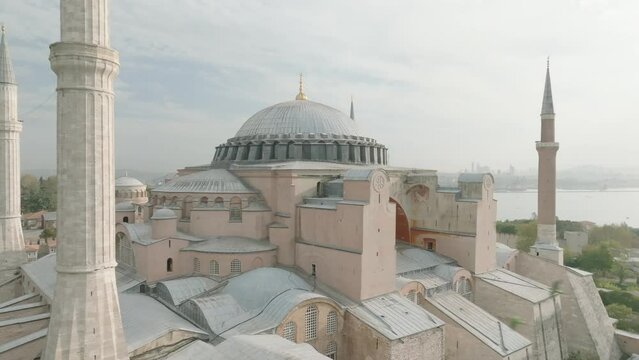 Istanbul, Hagia Sophia Great Mosque (Hagia Sophia), Aerial all-around view with Golden Horn and Topkapi Palace in the background at sunset