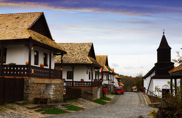 Rural landscape of tourist hungarian village Holloko with old wooden church