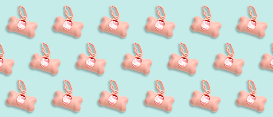 Pink dispenser with pet waste bags isolated on white background