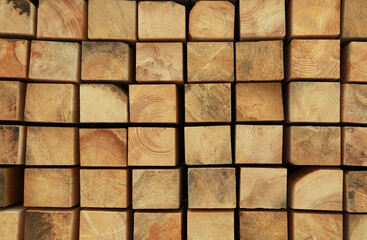 Many stacked wooden beams as background, closeup