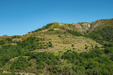 Fototapeta na wymiar Viewpoint of the Terraces (Miradouro dos Socalcos), overlooking the Agricultural terraces (famous Tibete style landscape view), Porta Cova place, Sistelo, Arcos de Valdevez, Portugal.