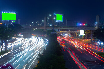 Time lapse photo at Dien Bien Phu street, Ho Chi Minh city with billboards with green background