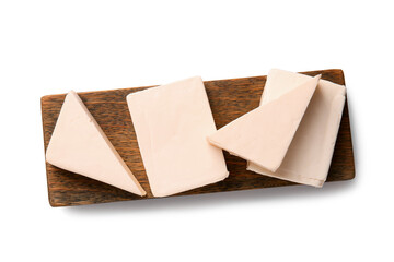 Board with processed cheese on white background