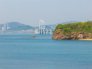 Fototapeta premium Spring seaside scenery of Binhai Road in Dalian, Liaoning province, China