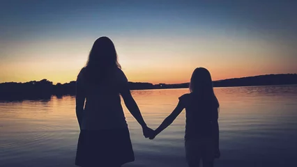  Mother and daughter enjoying the wonderful view in a beautiful sunset on Mother's Day © German