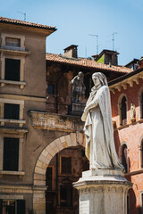 Fototapeta na wymiar Up-close Vertical Shot of Dante Alighieri Statue in Piazza dei Signori, Verona