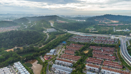 Aerial view of residential area with green asphalt road and residential houses directly above viewpoint. View of suburbs and city district. Real estate and housing market concept. - 601572600