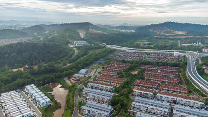 Aerial view of residential area with green asphalt road and residential houses directly above viewpoint. View of suburbs and city district. Real estate and housing market concept. - 601572602
