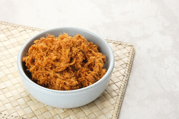 Abon Sapi, dried shredded beef or beef floss, served in bowl.
