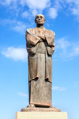 Fototapeta premium Nakatsu, Japan - Nov 26 2022: The statue of Fukuzawa Yukichi at Nakatsu station. He's an important person in Japanese History, educator, philosopher, writer, and samurai who founded Keio University