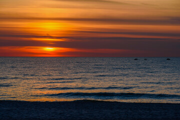 Spectacular bright golden sunset over Baltic sea