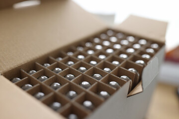Open cardboard box with test tubes in scientific laboratory