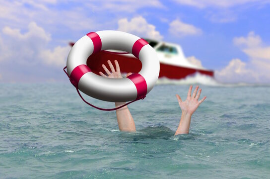 Rescue boat using life buoy trying to save drowning person at sea.