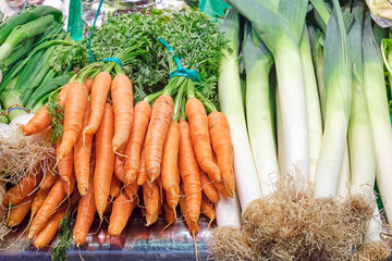 Carrots and leek for sale at a market