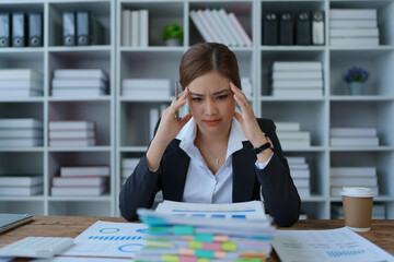 Portrait of business owner, woman using computer and financial statements Anxious expression on expanding the market to increase the ability to invest in business